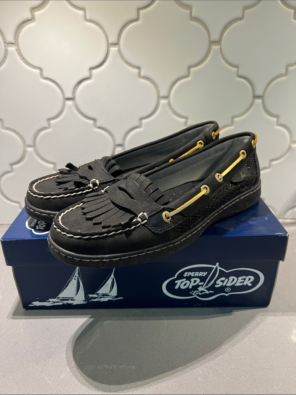 Sperry Black Kiltie Tassel Loafers with Gold Eyelet Accents